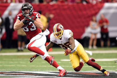 Atlanta Falcons tight end Jacob Tamme (83) runs past Washington Redskins free safety Dashon Goldson (38) after a catch during the first quarter at the Georgia Dome.