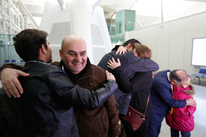 Fuad Sharef, an Iraqi with an immigration visa who was prevented with his family from boarding a flight to New York a week ago, hug his relatives goodbye at Erbil International Airport, Iraq February 4, 2017, to fly, on Turkish Airlines, to Nashville, Tennessee, their new home.