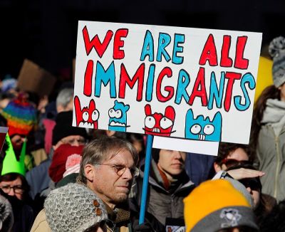 A demonstrator holds a sign to protest against U.S. President Donald Trump's executive order temporarily banning refugees and immigrants from seven primarily Muslim countries from entering the United States during a rally in Philadelphia, Pennsylvania, U.S. February 4, 2017