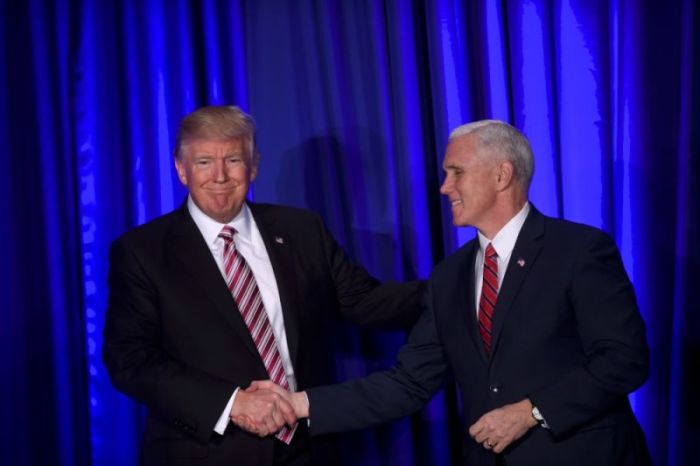 (L-R) U.S. President Donald J. Trump and Vice President Mike Pence greet one another on stage during the 2017 'Congress of Tomorrow' Joint Republican Issues Conference in Philadelphia, Pennsylvania, U.S. January 26, 2017.