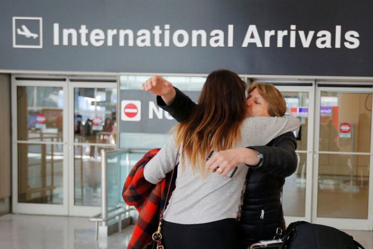 Mahnaz Kanani Zadeh (R) is greeted by her niece, Negin, after traveling to the U.S. from Iran following a federal court's temporary stay of U.S. President Donald Trump's executive order travel ban, at Logan Airport in Boston, Massachusetts, February 6, 2017.