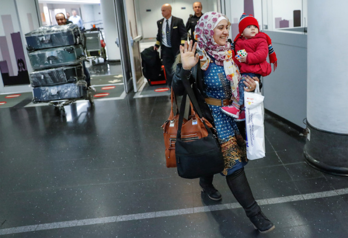 Syrian refugee Baraa Haj Khalaf, her daughter Shams, 1, and husband Abdulmajeed arrive at O'Hare International Airport in Chicago, Illinois, U.S. February 7, 2017.