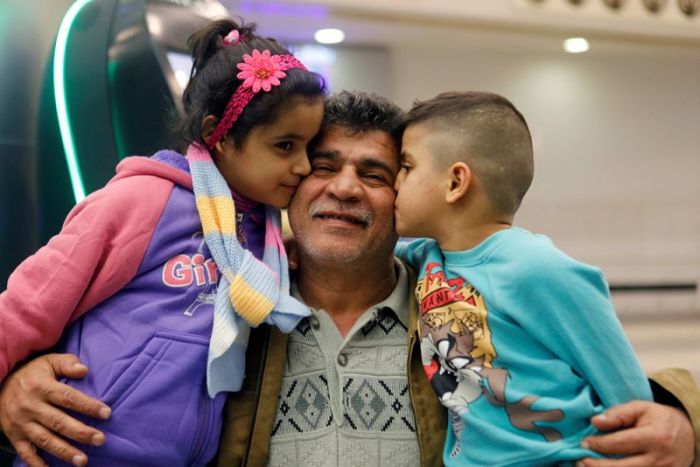 Nizar al-Qassab, an Iraqi Christian refugee from Mosul, sees his children off at Beirut international airport ahead of their travel to the United States, Lebanon, February 8, 2017.