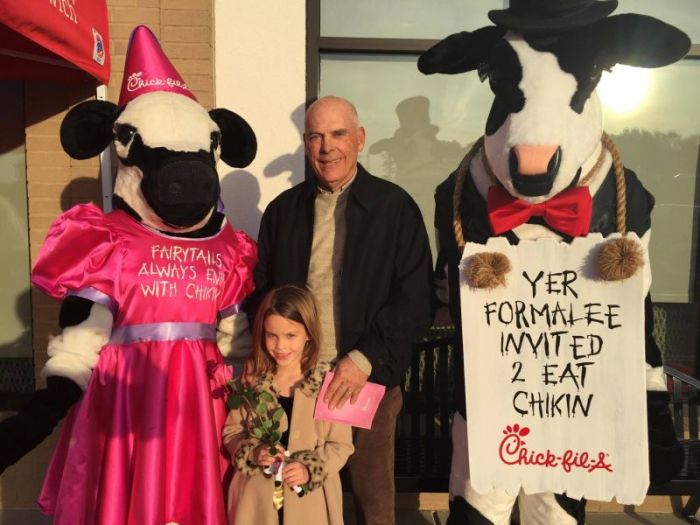 A grandfather and granddaughter attend a Chick-Fil-A 'Daddy Daughter Date Night,' February 4, 2017, Line Creek, Georgia.