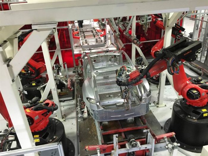 Tesla vehicles are being assembled by robots at Tesla Motors' factory in Fremont, California, July 25, 2016.