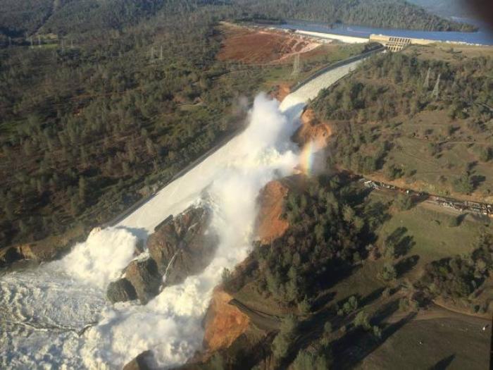 A damaged spillway with eroded hillside is seen in an aerial photo taken over the Oroville Dam in Oroville, California, U.S. February 11, 2017.