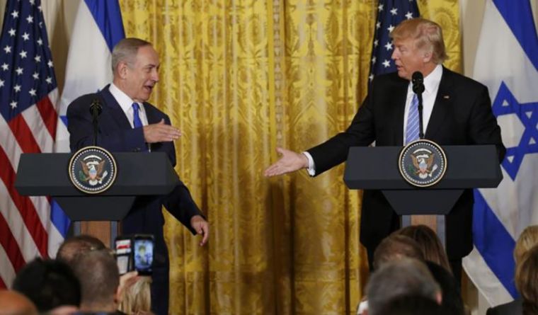 U.S. President Donald Trump (R) greets Israeli Prime Minister Benjamin Netanyahu after a joint news conference at the White House in Washington, February 15, 2017.