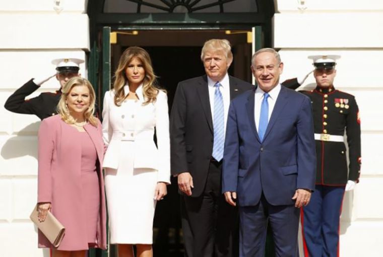 U.S. President Donald Trump (2ndR) and first lady Melania Trump greet Israeli Prime Minister Benjamin Netanyahu and his wife Sara (L) as they arrive at the South Portico of the White House in Washington, U.S., February 15, 2017.