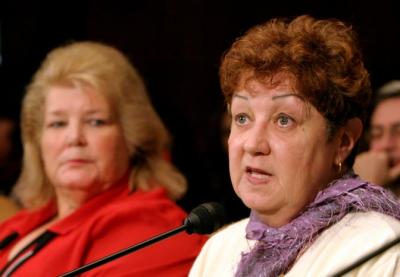 Norma McCorvey of Dallas, Texas (R), the “Roe” in the Roe v. Wade Supreme Court case, testifies before the U.S. Senate Judiciary Committee along with Sandra Cano of Atlanta, Georgia, the “Doe” in the Doe v. Bolton Supreme Court case, on Capitol Hill in Washington, DC June 23, 2005. 