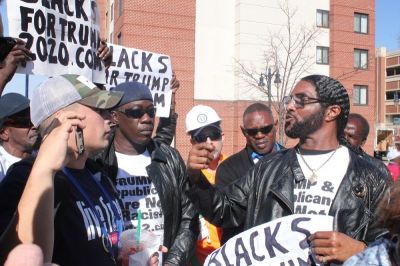 Maurice Symonette (R), of Blacks for Trump, debates political issues outside of the Conservative Political Action Conference at the Gaylord National Resort and Convention Center in Oxon Hill, Maryland on Feb.24, 2017.