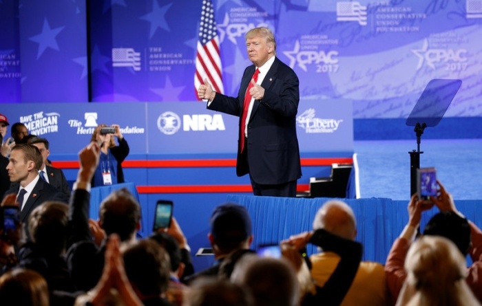 U.S. President Donald Trump gives his supporters a thumbs up he spoke at the Conservative Political Action Conference, or CPAC, in Oxon Hill in Maryland, U.S., February 24, 2017.