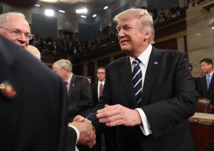 U.S. President Donald Trump shakes hands after delivering his first address to a joint session of Congress from the floor of the House of Representatives in Washington, U.S. on Feb. 28, 2017.