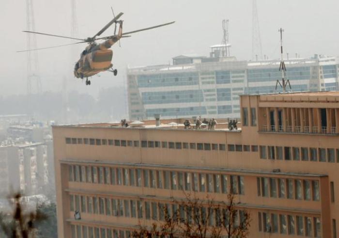 Afghan National Army (ANA) soldiers descend from helicopter on a roof of a military hospital during gunfire and blast in Kabul, Afghanistan March 8, 2017.