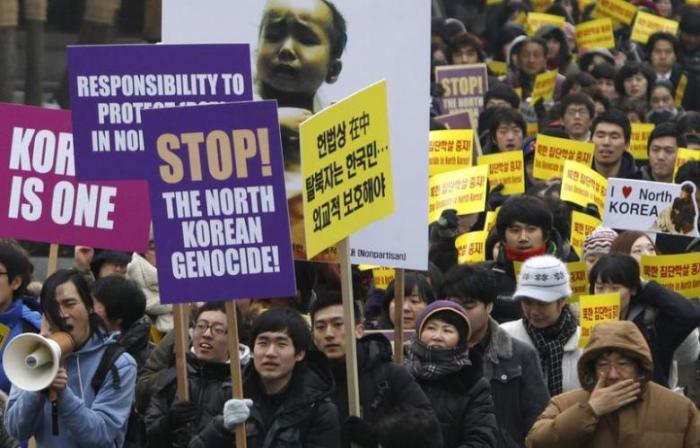 South Korean Christians and former North Korean defectors living in the South march during a rally to protest against what they say is North Korea's violation of human rights, in Seoul January 27, 2012.