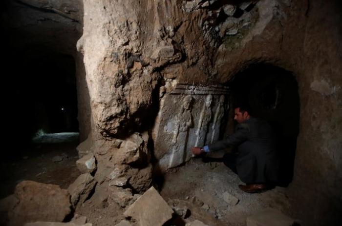 Archaeologist Musab Mohammed Jassim shows artifacts and archaeological pieces in a tunnel network running under the Mosque of Prophet Jonah, Nabi Yunus in Arabic, in eastern Mosul, Iraq March 9, 2017.