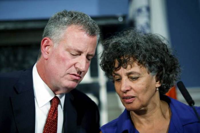 New York City Mayor Bill de Blasio (L) speaks to Department of Health and Mental Hygene Dr, Mary Bassett while they attend a news conference to introduce legislation intended to reduce the risk of Legionnaire's disease in New York, August 10, 2015.