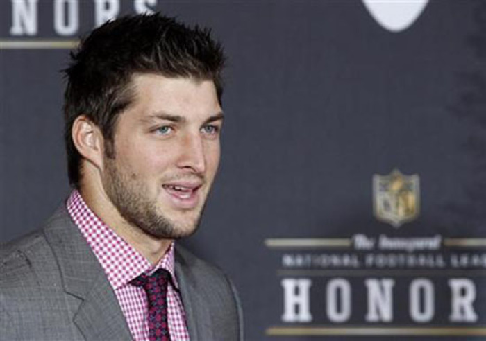 Former Denver Broncos quarterback Tim Tebow arrives for the Inaugural National Football League Honors at Super Bowl XLVI in Indianapolis.