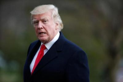 U.S. President Donald Trump walks from Marine One upon his return to the White House.