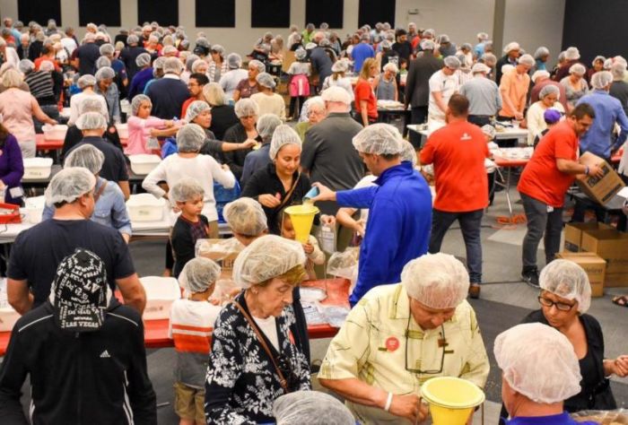 Churchgoers at Christ Fellowship in Royal Palm Beach, Florida prepare meals that are to be sent to refugees in the Middle East or impoverished people in their communities on March 19, 2017.