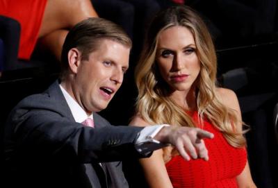 Donald Trump's son Eric Trump and his wife, Lara Yunaska watch the proceedings during the third day of the Republican National Convention in Cleveland, Ohio, U.S., July 20, 2016.