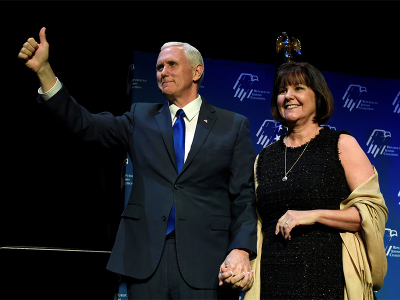 U.S. Vice President Mike Pence, left, and his wife, Karen Pence acknowledge the audience before he speaks at the Republican Jewish Coalition's annual meeting in Las Vegas, Nevada February 24, 2017.