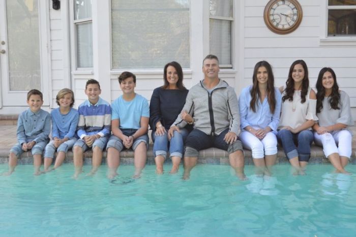 Bryan and Diane Schwartz and their seven children pose by the pool in this undated photo.