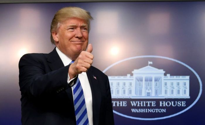 U.S. President Donald Trump gives a thumbs up as he hosts a CEO town hall on the American business climate at the Eisenhower Executive Office Building in Washington, U.S., April 4, 2017.