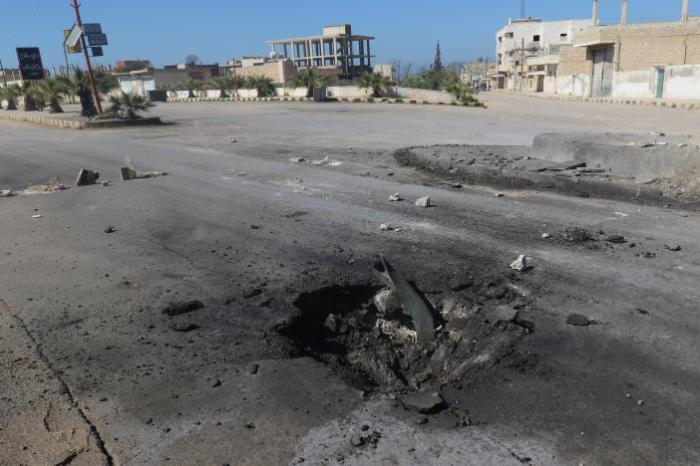 A crater is seen at the site of an airstrike, after what rescue workers described as a suspected gas attack in the town of Khan Sheikhoun in rebel-held Idlib, Syria April 4, 2017.