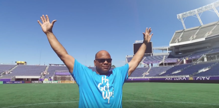 Pastor Tim Johnson, former professional American football defensive lineman raises his hands to Heaven at 'He Got Up,' Orlando, Florida 2016.