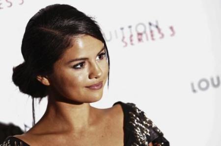 Actress Selena Gomez arrives for the "Louis Vuitton Series 3" Exhibition gala opening in London, Britain.