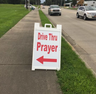 A sign for the 2016 Good Friday Drive-Thru prayer event, held by Louisiana Avenue United Methodist Church of Lafayette, Louisiana.