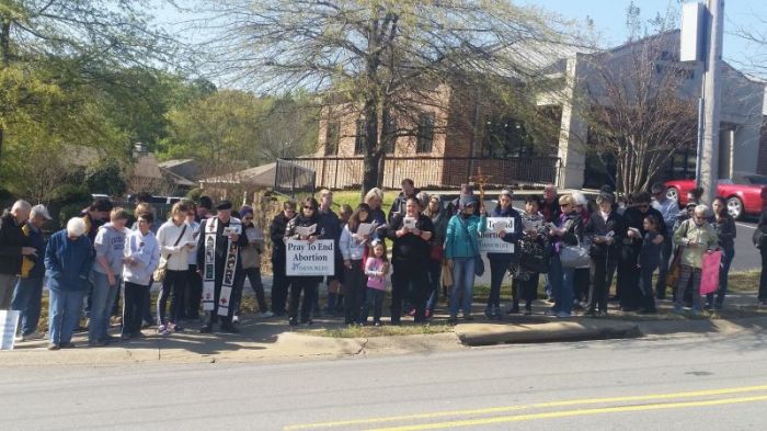 Pro-life activists pray the 'Way of the Cross for Victims of Abortion' outside an abortion clinic in Little Rock, Arkansas.