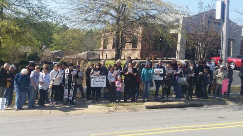Pro-life activists pray the "Way of the Cross for Victims of Abortion" outside an abortion clinic in Little Rock, Arkansas.