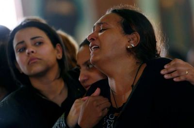 Relatives mourn for the victims of the Palm Sunday bombings during their funeral at the Monastery of Saint Mina in Alexandria, Egypt, on April 10, 2017.