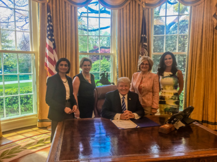 President Donald Trump signs measure revoking Obama Era measure denying states the ability to prohibit abortion providers from getting Title X funds. From Left to Right: Trump Administration health official Seema Verma, Susan B. Anthony List President Marjorie Dannenfelser, President Trump (seated), U.S. Congresswoman Diane Black of Tennessee, and Concerned Women for America CEO Penny Nance.