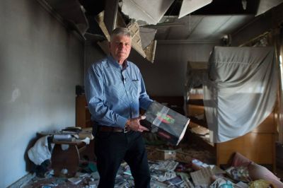 Franklin Graham holds a Samaritan's Purse Operation Christmas Child shoebox, which he discovered in a ruined church in Qaraqosh, Iraq.