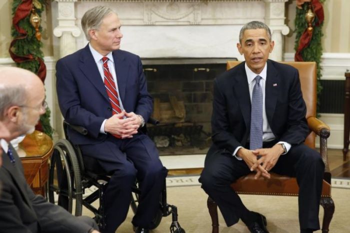 Former U.S. President Barack Obama is pictured next to Texas Governor Greg Abbott(C), at a meeting with governors-elect from seven states at the White House in Washington, Dec. 5, 2014.