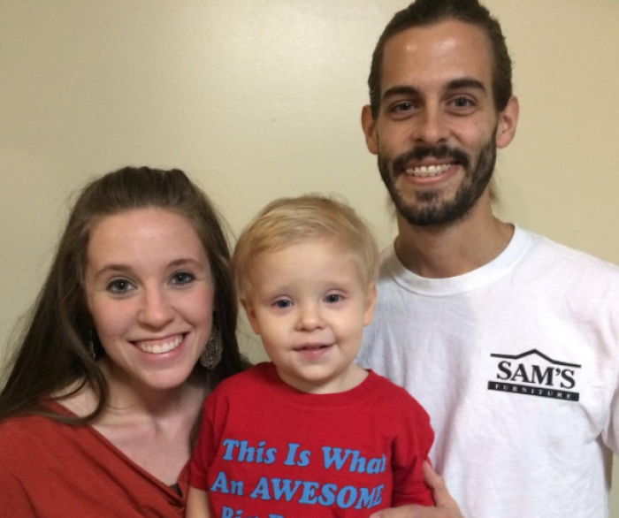 Jill Duggar Dillard and Derick Dillard smile at the camera together with their first-born son, Israel David. They are expecting the birth of their second son, already being called little Samuelito, this July.