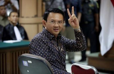 Jakarta's Governor Basuki Tjahaja Purnama gestures inside the courtroom during his blasphemy trial at the North Jakarta District Court in Jakarta, Indonesia, on Dec. 27, 2016.