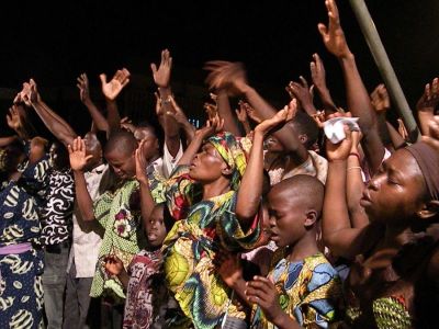 Christians pray at a gathering at a football stadium in the West African nation of Benin.