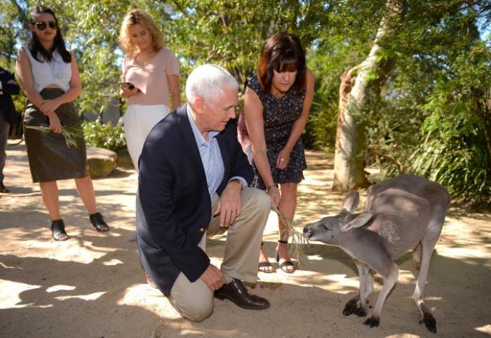 U.S. Vice President Mike Pence looks at a kangaroo called Penny with his wife Karen and their daughters Audrey (L) and Charlotte during a visit to Taronga Zoo in Sydney, Australia, April 23, 2017.