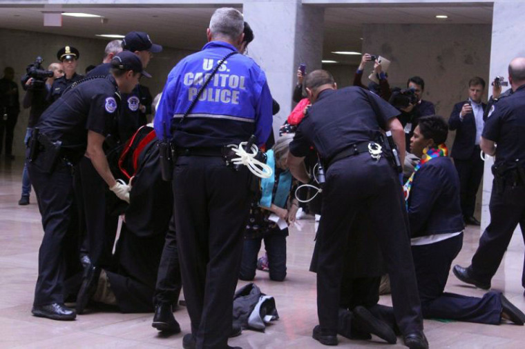 Seven faith leaders are detained by Capitol Police after they demonstrated against the proposed budget of President Donald Trump at the Hart Senate Office Building in Washington, D.C. on April 24, 2017.