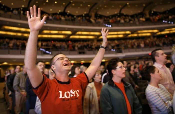 Worshipers fill the 7,000-seat Willow Creek Community church during a Sunday service in South Barrington, Illinois.