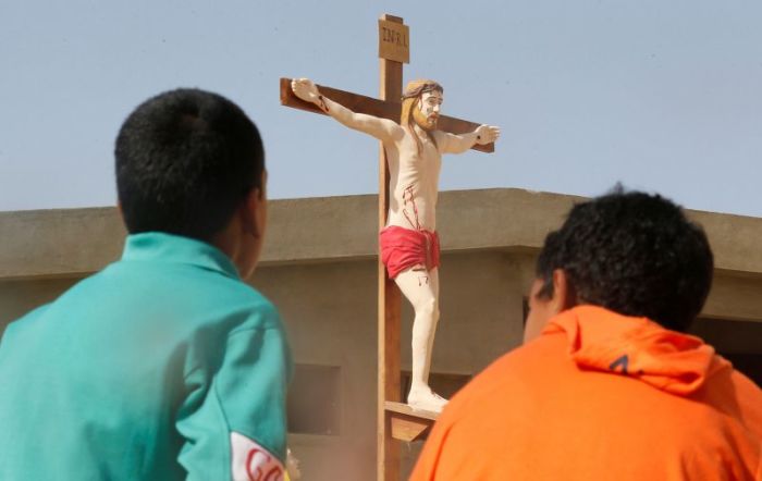 These Christian children, looking at a model of Christ at the Saint Church in Ismailia, northeast of Cairo, left Arish in North Sinai after Islamic State militants mounted a campaign targeting Christians in this undated photo.