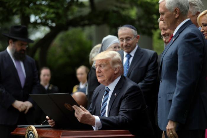 U.S. President Donald Trump prepares to sign the Executive Order on Promoting Free Speech and Religious Liberty during the National Day of Prayer event at the Rose Garden of the White House in Washington D.C., U.S., May 4, 2017.