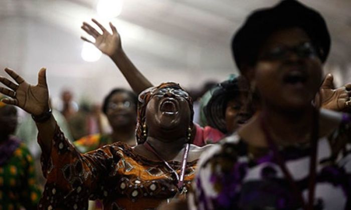 Pentecostals worship at a church in Nigeria.