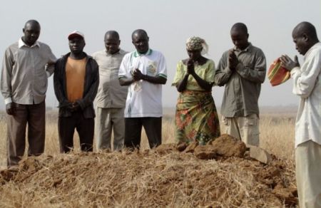A Christian family mourns three relatives killed by armed Fulani herdsmen in Jos, Plateau state, Nigeria, in December 2011.