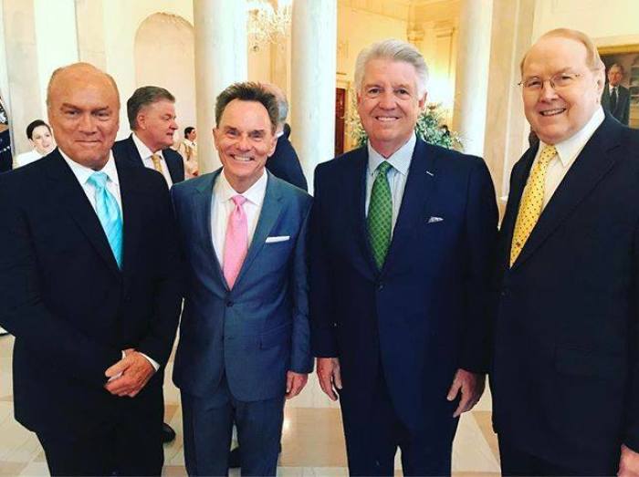 Evangelical leaders Greg Laurie (blue tie), Ronnie Floyd (pink tie), Jack Graham (green tie) and James Dobson (yellow tie) pose for a picture as they attend a private dinner with President Donald Trump, Vice President Mike Pence and cabinet officials at the White House in Washington, D.C. on May 3, 2017.
