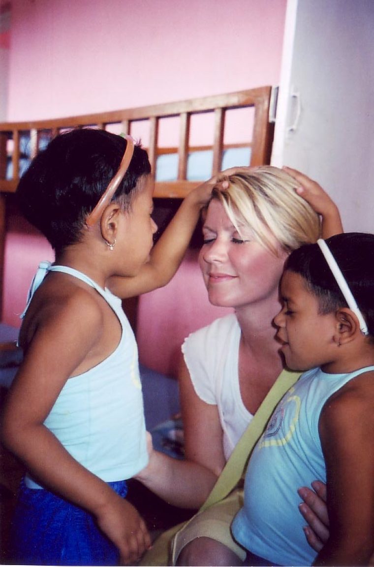 Natalie Grant prays for children during a trip to India.