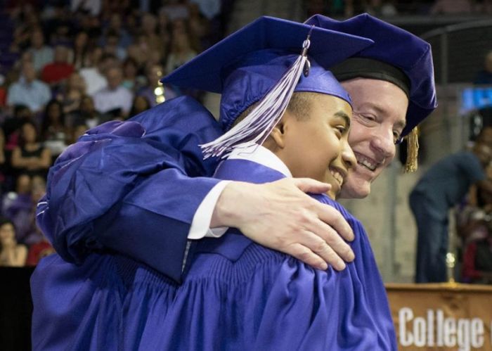 Carson Huey-You, 14, Texas Christian University's youngest graduate, poses with Victor J. Boschini, Jr., the school's chancellor at his graduation on Saturday May 13, 2017.